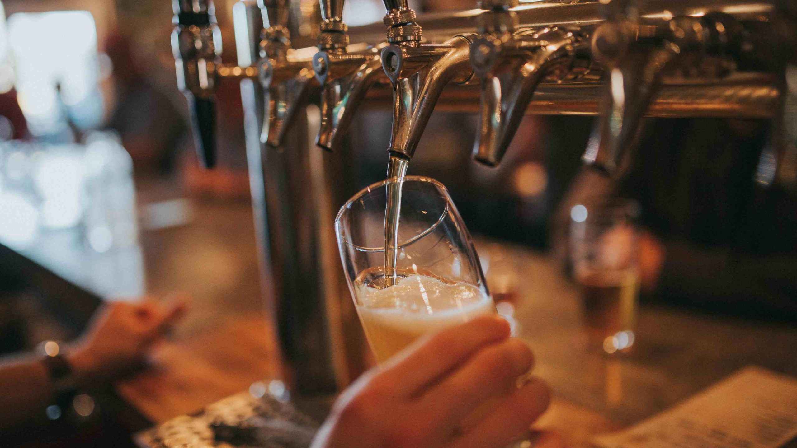 Beer getting poured into a glass