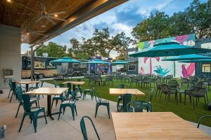 Support small businesses in Orlando like A La Cart, with its indoor/outdoor vibes, craft beverages, and local food trucks.